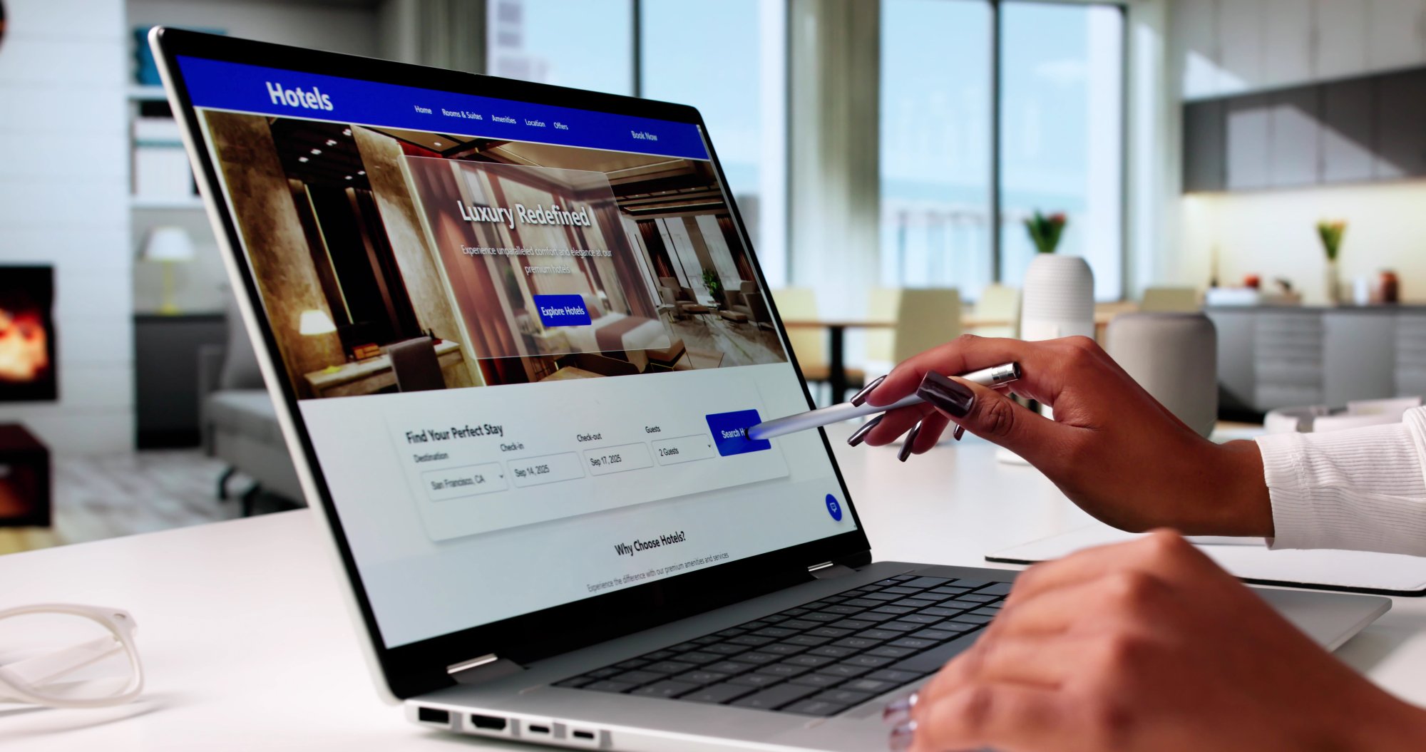 A person using a stylus to interact with a hotel booking website displayed on a laptop screen