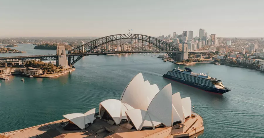 A stunning aerial view of Sydney's most iconic landmarks—the distinctive Opera House with its