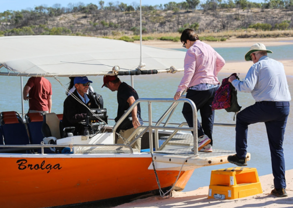 Guests stepping aboard Brolga, the custom cruise vessel at Berkeley River Lodge, on the Berkeley River